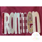 House Party Zigzag Applique Machine Embroidery Font: IRONMEN in maroon and cream patterned applique letters on a maroon sweatshirt