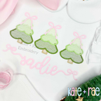 Girls Sketch Stitch Christmas Tree Trio with Satin Stitch Outline Embroidery Design: Close-up of three green sketch Christmas trees with pink bows above the name sadie in pink script