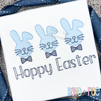 Three blue sketch bunnies with bow ties above Hoppy Easter in outline lettering on a white shirt