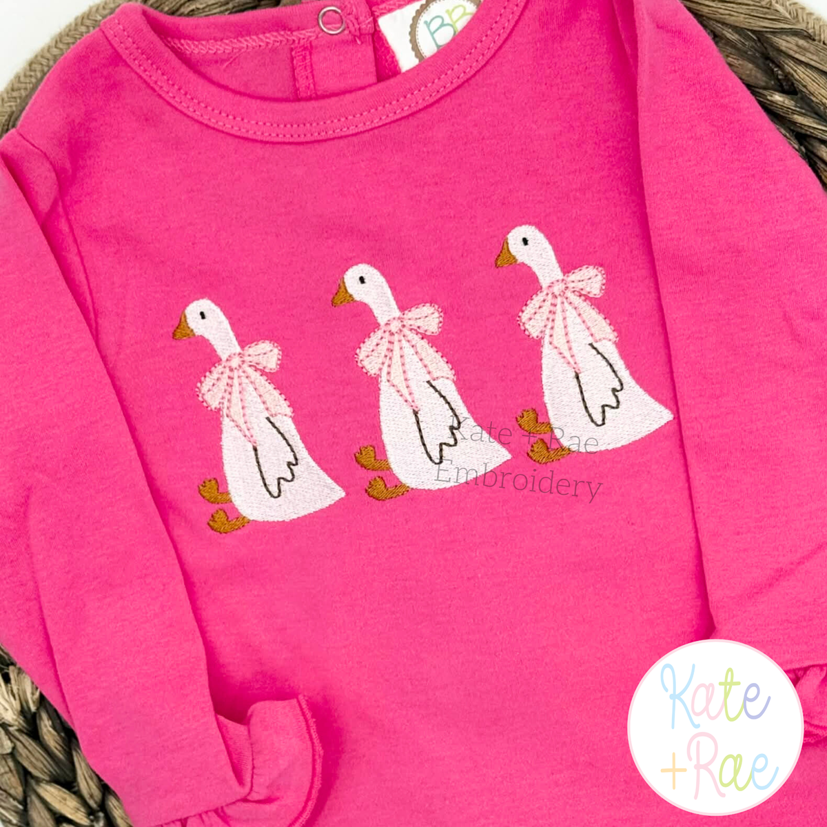Girl Goose Sketch Stitch with Bow Embroidery Design: Three sketch geese with pink bows on a hot pink ruffle shirt