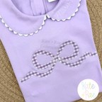 Flowy Longtail Bow Zigzag Stitch Applique Embroidery Design: Purple gingham flowy bow zigzag applique on a lavender collared shirt