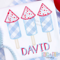 Boy's Firework Trio Zigzag Applique Embroidery Design: Three blue gingham firework rocket appliques with red star tops above the name DAVID in red on a white shirt