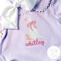 Girl Goose Sketch Stitch with Bow Embroidery Design: White sketch goose with a pink bow above the name whitley in pink on a lavender shirt