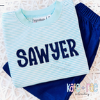 Gracie Zigzag Stitch Applique Embroidery Font: The name SAWYER in navy zigzag applique letters on a mint striped shirt