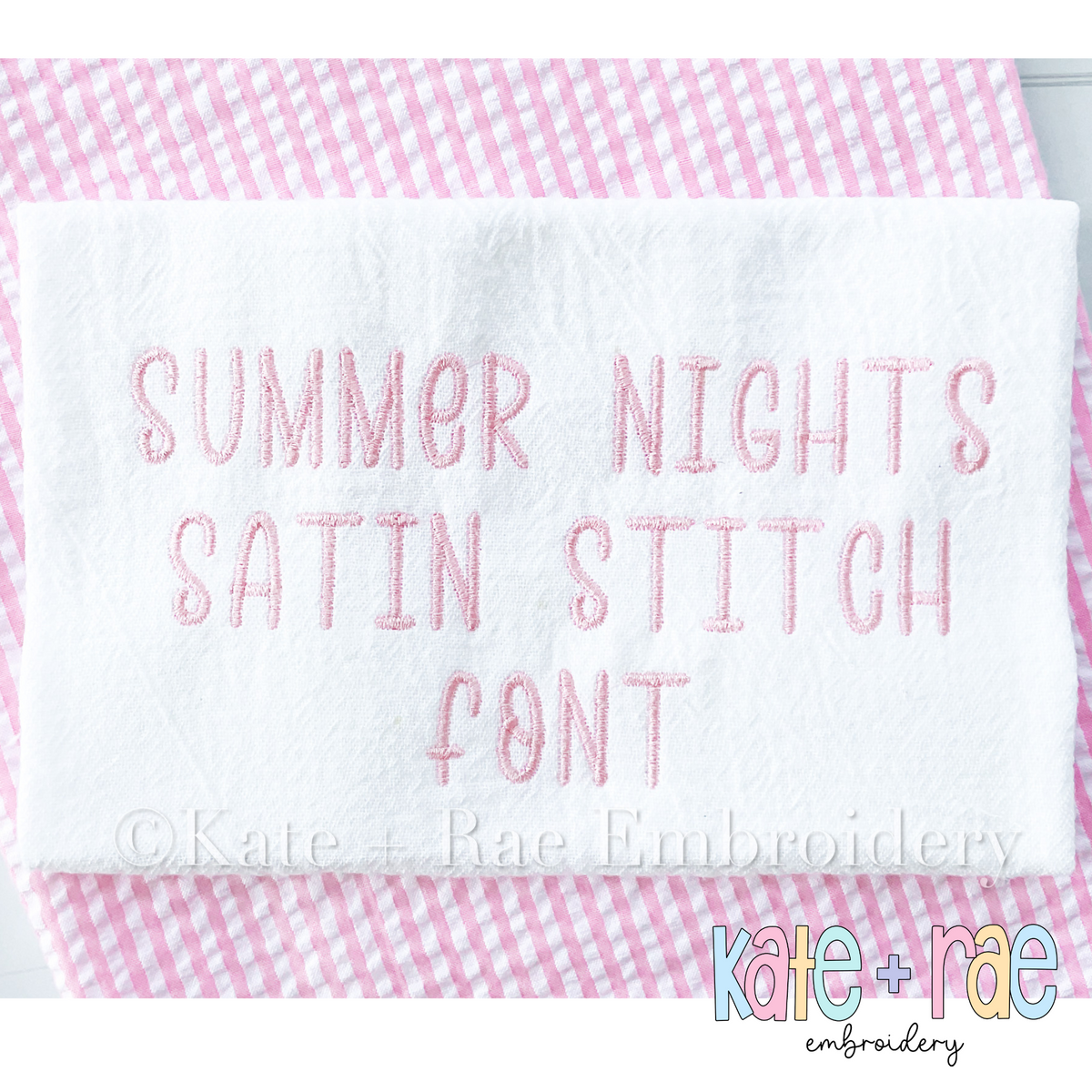 Summer Nights Satin Stitch Embroidery Font: The words Summer Nights Satin Stitch Font stitched in pink satin on white fabric over pink gingham
