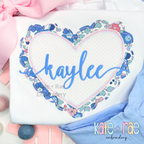Scalloped Double Heart Bean Stitch Applique Embroidery Design: Blue floral scalloped heart applique with the name kaylee in blue script on a white shirt