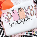 Girls Spooky Season Sketch Stitch Embroidery Design: Pink and peach sketch ghosts with bows in SPOOKY above season in black script on a white shirt