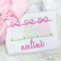 Girl's Easter Egg Trio Zigzag Applique Embroidery Design: Three pink applique Easter eggs with bows above the name Nalini in pink script on a white shirt