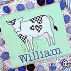 Valentine's Day Cow with Hearts Zigzag Stitch Applique Embroidery Design: Cow applique with black gingham heart spots above the name William in navy on a mint shirt