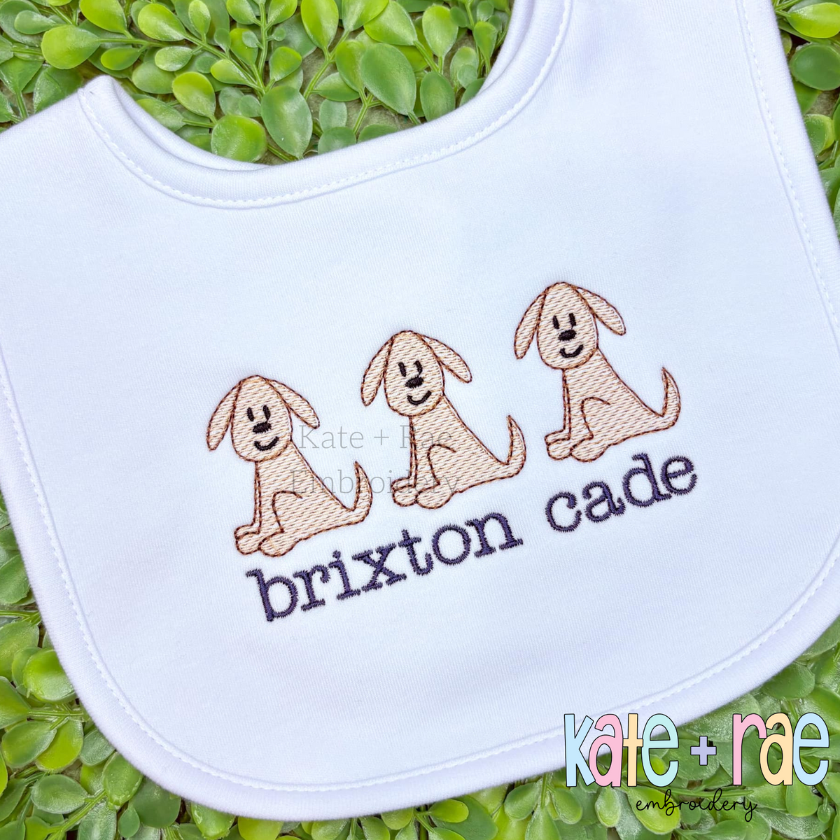 Lincoln Puppy Dog Trio Sketch Stitch Embroidery Design: Three tan sketch stitch puppies above the name brixton cade in navy on a white bib