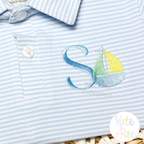 Boy's Sailboat Mini Fill Stitch Embroidery Design: Blue letter S with a mini sailboat on a light blue striped polo