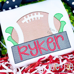Football with Name Plate Sketch Stitch Applique Embroidery Design: Sketch stitch football above a gray name plate reading Ryker in red on a white shirt