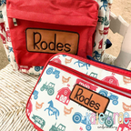 Rectangle Satin Stitch Patch Applique Embroidery Design: Brown leather rectangle patches with the name Rodes on a red backpack and farm print lunchbox
