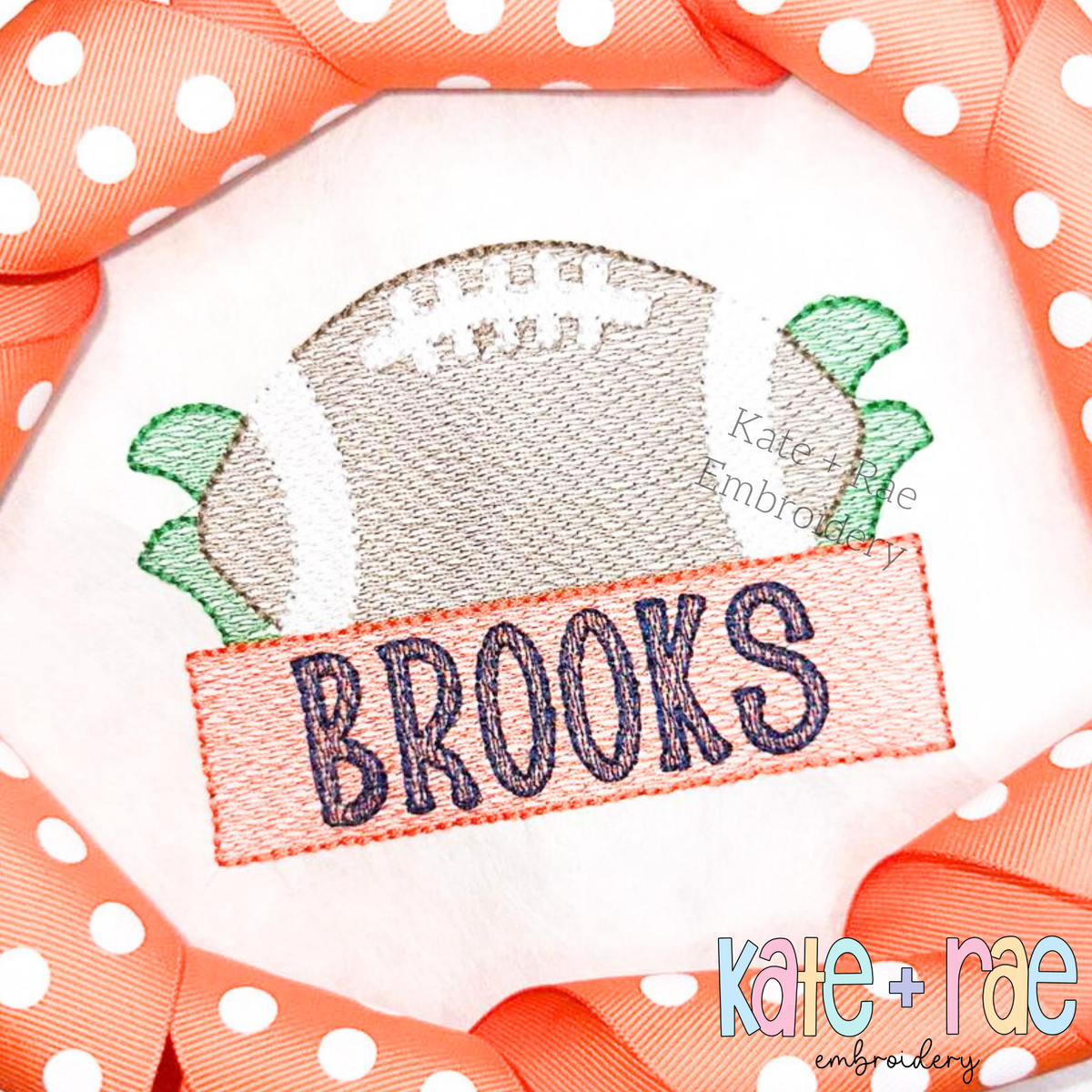 Football with Name Plate Sketch Stitch Applique Embroidery Design: Sketch stitch football above an orange name plate reading BROOKS in navy on a white shirt