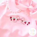 Strawberry Bow Vine Satin Stitch Embroidery Design: Strawberry vine with a red bow on a pink collared shirt