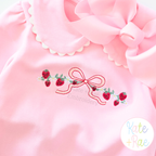 Strawberry Bow Vine Satin Stitch Embroidery Design: Strawberry vine with a red bow on a pink collared shirt