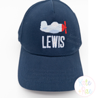 Airplane Mini Fill Stitch Embroidery Design: Mini airplane above LEWIS in white letters on a navy baseball cap