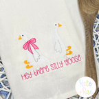 Girl Goose Mini Fill with Bow Embroidery Design: Tea towel with two geese and Hey there silly goose in pink lettering