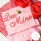 Valentine Heart Satin Stitch Embroidery Font: Bee Mine in red heart satin script with a small bee on a pink shirt