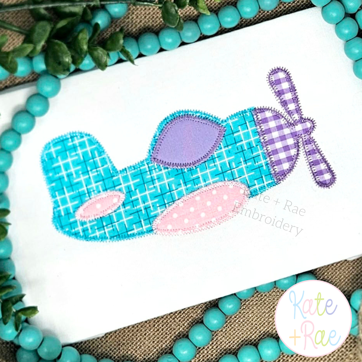 Airplane Zigzag Stitch Applique Embroidery Design: Teal plaid and purple gingham airplane zigzag applique on a white shirt