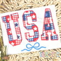 Curved USA with Bow Zigzag Stitch Applique Embroidery Design: USA in red and blue plaid star print zigzag applique letters with a blue bow on a white shirt