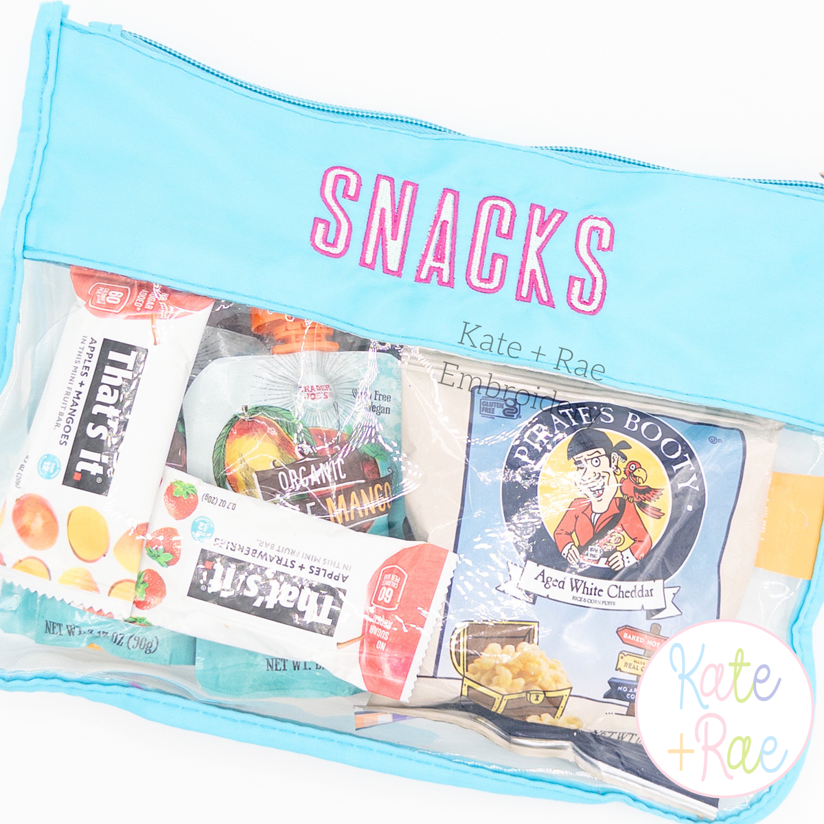 Beau Fill Stitch with Satin Border Embroidery Font: SNACKS in pink fill stitch letters with satin border on a clear aqua snack pouch