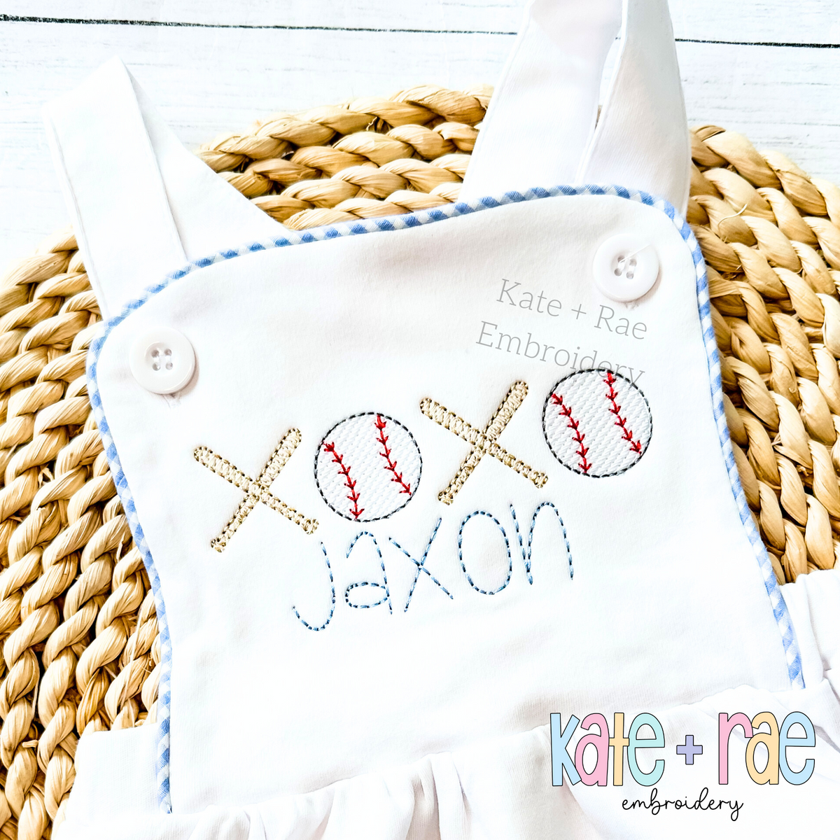 Baseball XOXO Sketch Stitch Embroidery Design: Crossed bats and baseballs spelling XOXO above the name Jaxon in blue on a white bubble romper