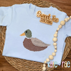 Mallard Duck Cross Stitch Embroidery Design: Mallard duck cross stitch on a light blue tee