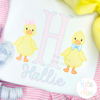 Duck with Bow Tie Sketch Stitch Embroidery Design: Pink letter H with a girl duck and a boy duck above the name Hallie on a white shirt