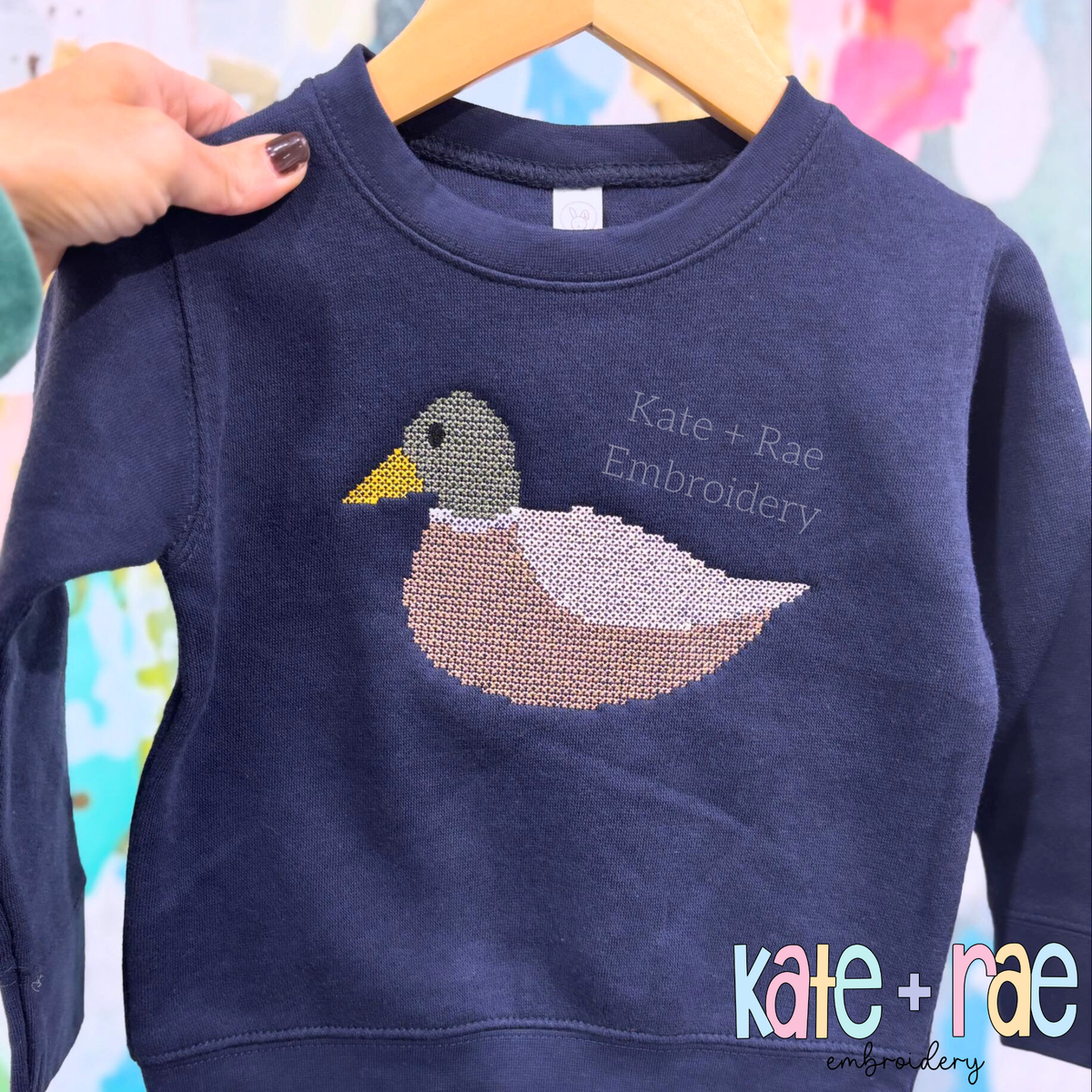 Mallard Duck Cross Stitch Embroidery Design: Mallard duck cross stitch on a navy sweatshirt
