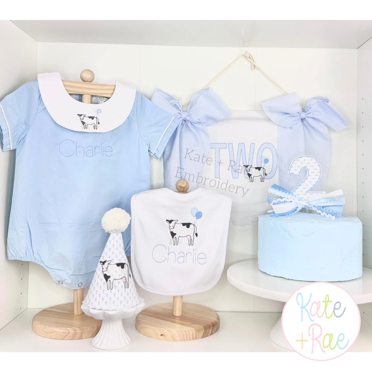 Cow with Birthday Balloons Sketch Stitch Embroidery Design: First birthday setup with cow embroidered romper, bib, party hat, TWO banner, and cake topper