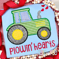 Tractor with Hearts Satin Stitch Applique Embroidery Design: Green gingham tractor applique with hearts above the words plowin' hearts in red on a light blue shirt