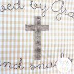 Cross Stitch Mini Cross Embroidery Design: Gray cross stitch cross on tan gingham with script lettering around it