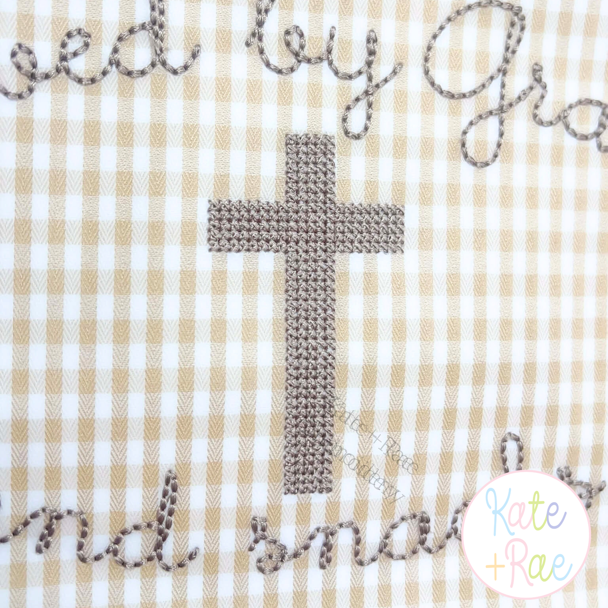 Cross Stitch Mini Cross Embroidery Design: Gray cross stitch cross on tan gingham with script lettering around it