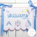 Scallop bottom banner with The Williams Family in blue and princess icons