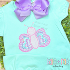 Butterfly Bean Stitch Applique Embroidery Design: Pink gingham and striped butterfly bean stitch applique on a mint ruffle sleeve shirt