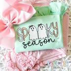 Girls Spooky Season Sketch Stitch Embroidery Design: SPOOKY with two ghosts wearing bows above season in black script on a mint ruffle top