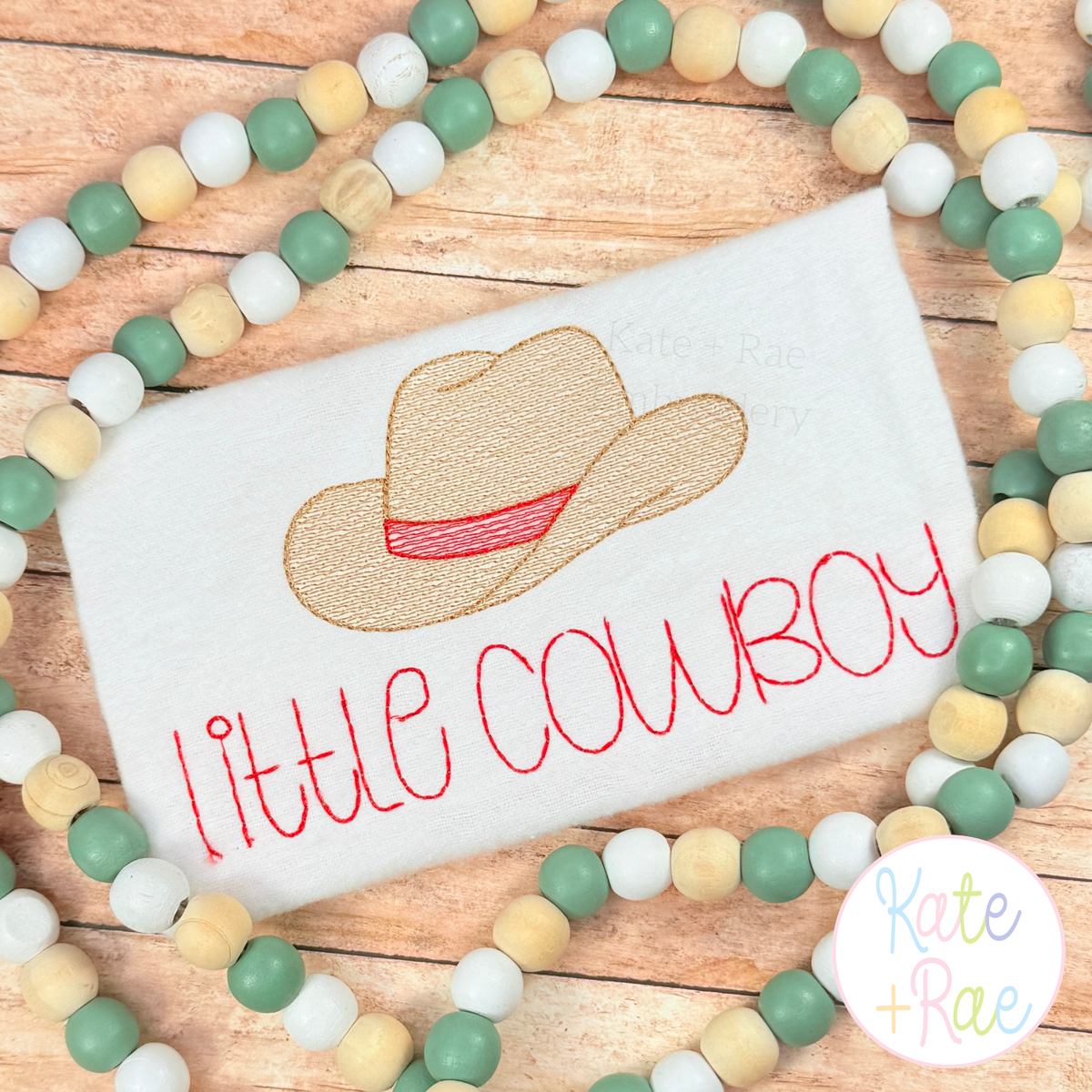 Cowboy Hat Mini Sketch Stitch Embroidery Design: Tan sketch cowboy hat with a red band above little cowboy in red on a white shirt