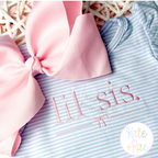 Lil Sis with Bow Satin Stitch Embroidery Design: Lil sis. in pink satin lettering with a bow on a blue striped shirt