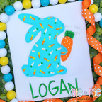Boy's Easter Bunny with Carrot Zigzag Stitch Applique Embroidery Design: Aqua carrot print bunny applique holding an orange carrot above the name Logan in green on a white shirt