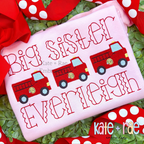 Firetruck Mini Fill Stitch Embroidery Design: Three red firetrucks between the words Big Sister and Everleigh in red on a pink shirt