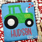 Tractor with Hearts Zigzag Stitch Applique Embroidery Design: Green tractor applique with hearts above the name HUDSON in red on a blue shirt
