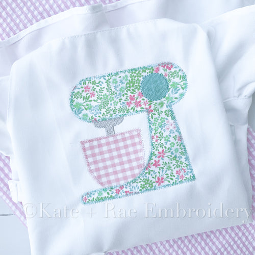 Baking Mixer Zigzag Applique Embroidery Design: Stand mixer applique in teal floral fabric with a pink gingham bowl stitched on a white shirt