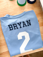 Back of Jersey Names - Softball & Baseball: Light blue jersey with BRYAN and number 2 on the back