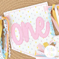 Birth/ Birthday Bean Stitch Applique Banner In The Hoop Embroidery Design: Polka dot pennant banner with one in pink applique and colorful ribbon ties