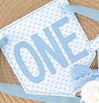 Blue ONE applique on a blue print pennant banner with ribbons