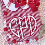 Heart Monogram Satin Stitch Applique Embroidery Design: Heart shaped monogram EPD in white polka dot applique on a red striped dress