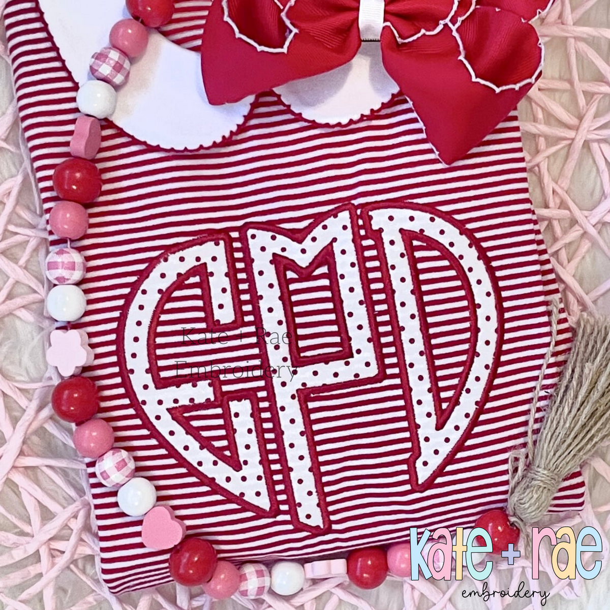 Heart Monogram Satin Stitch Applique Embroidery Design: Heart shaped monogram EPD in white polka dot applique on a red striped dress