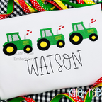 Heart Tractor Trio Fill Stitch Embroidery Design: Three green tractors with yellow wheels and hearts above the name WATSON in black on a white shirt