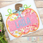 Girl's Pumpkin Satin Applique Embroidery Design: Pink floral pumpkin applique with a bow and the name LAILA on a white shirt
